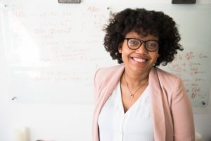 For Teachers Teacher standing in front of a whiteboard